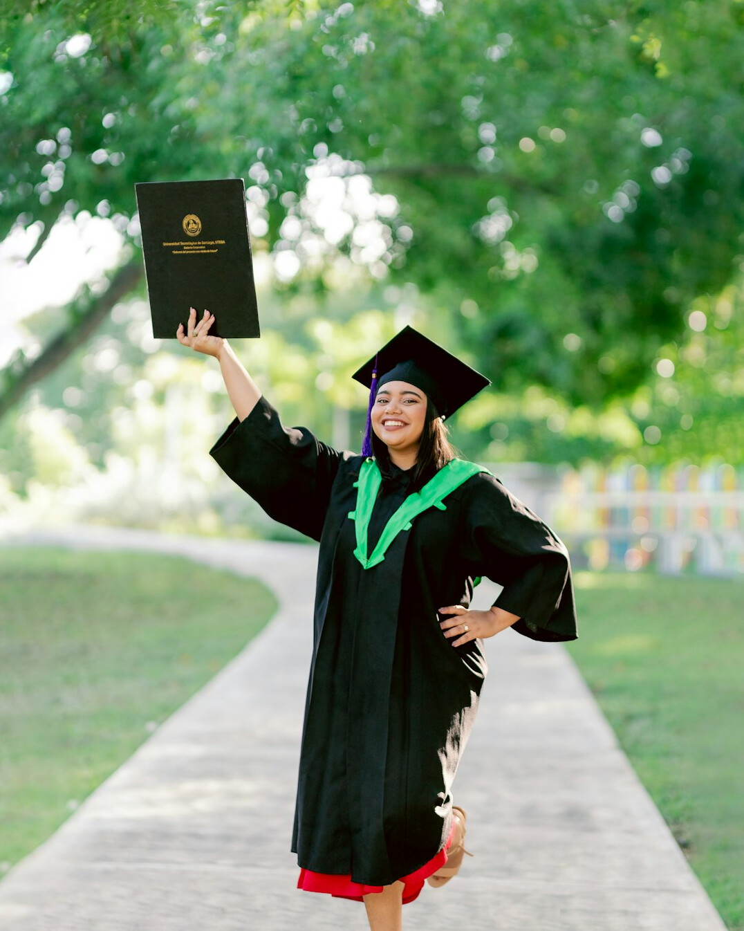 happy graduate holding certificate