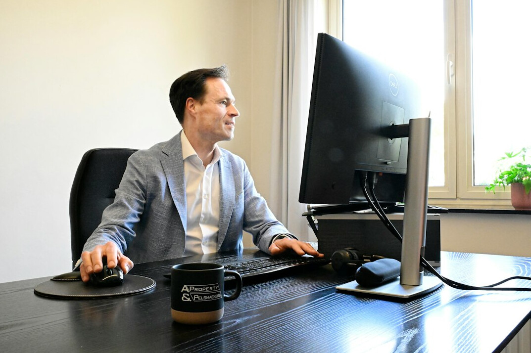 successful programmer at desk